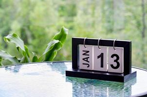 13 January calendar table with blurred nature background. With customizable space for text or ideas photo