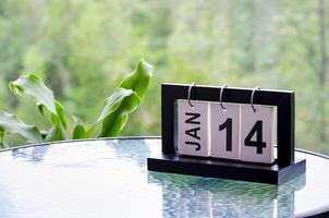 14 January calendar table with blurred nature background. With customizable space for text or ideas photo