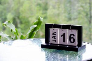 16 January calendar table with blurred nature background. With customizable space for text or ideas photo