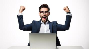 A man in a suit and glasses is sitting at a desk with his arms up photo