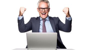 A man in a suit and glasses is sitting at a desk with his arms up photo