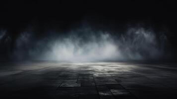 An empty room with a dark floor and a light coming from the ceiling photo