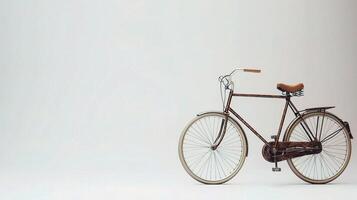 An old bicycle is shown against a white background photo
