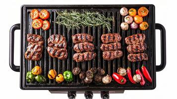 A grill with meat and vegetables on it photo
