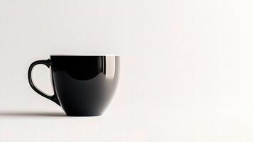 A black coffee cup on a white surface photo