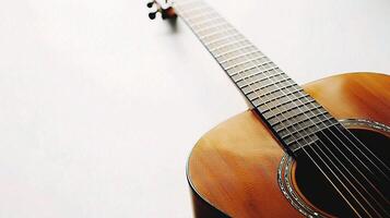An acoustic guitar is shown against a white background photo