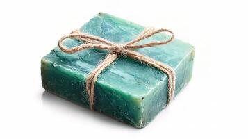 A green soap bar wrapped in twine photo