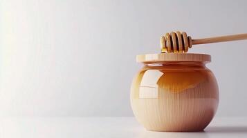 Honey jar with wooden spoon on white background 3d render photo