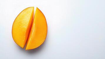 A cut mango on a white surface photo