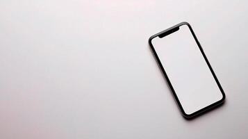 An iphone is shown on a white surface photo