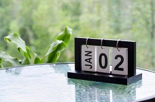2 January calendar table with blurred nature background. With customizable space for text or ideas photo
