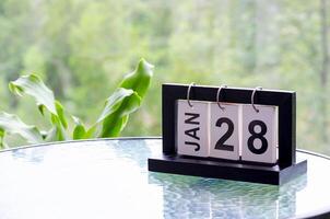 28 January calendar table with blurred nature background. With customizable space for text or ideas photo
