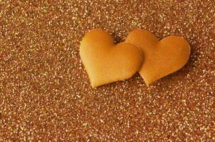 Top view of heart shape on golden vintage cover wallpaper with customizable space for text photo