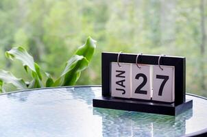 27 January calendar table with blurred nature background. With customizable space for text or ideas photo
