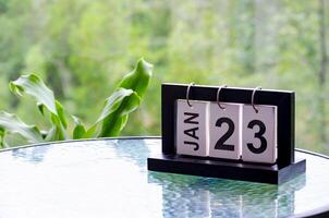 23 January calendar table with blurred nature background. With customizable space for text or ideas photo