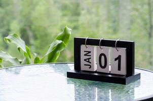 1 January calendar table with blurred nature background. With customizable space for text or ideas photo
