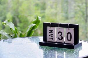 30 January calendar table with blurred nature background. With customizable space for text or ideas photo