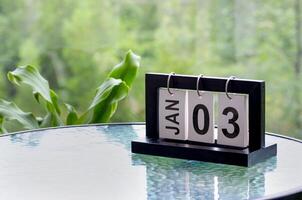 3 January calendar table with blurred nature background. With customizable space for text or ideas photo