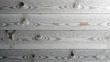 Textured wooden planks with knots and grain patterns in weathered gray tones photo