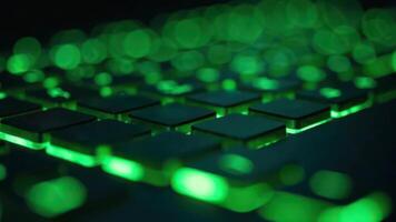 Close-up of green led-illuminated keyboard with blurred bokeh effect photo