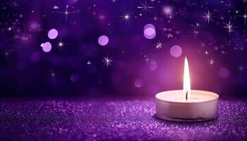 Glowing candle on sparkling purple background with soft bokeh and stars photo