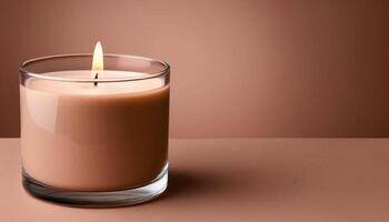 Warm glow from a lit scented candle on brown background photo