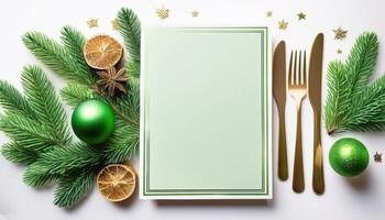 Elegant christmas table setting with green ornaments and fir branches photo
