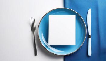 Minimalistic table setting with blue plate and cutlery photo