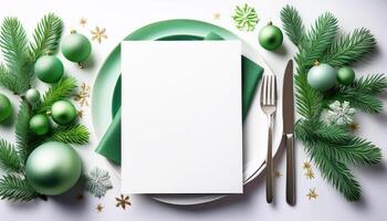 Elegant christmas table setting with green ornaments and silverware photo