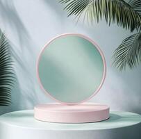 a pink mirror on a round stand in front of palm trees photo