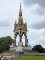 A large statue with a clock on top of it photo