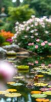 Blossoming flowers surround a serene pond filled with lily pads and gentle reflections in a peaceful garden photo