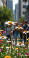 Vibrant flowers bloom amidst urban street activity on a sunny day in a downtown area photo
