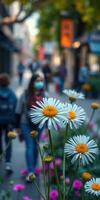 People walking in a lively street filled with blooming flowers on a sunny day photo