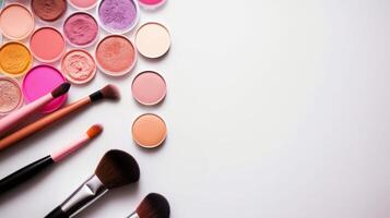 Assorted Makeup Brushes and Cosmetics on White Surface photo