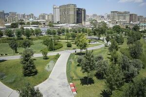 Urban Park with Pathways and Greenery in the City photo