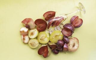 Cutted of Plum and Peach put on pastel background photo