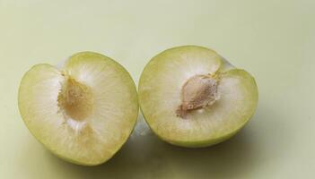 Cutted of Lemon Plum with yellow pulp, photo