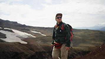 Equipped Tourist Walking In Mountains, Carrying Backpack And Photo Camera, Slow Motion Portrait video