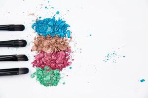 Eyeshadow glitter splash beside brush set photo