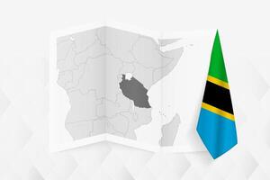 A grayscale map of Tanzania with a hanging Tanzanian flag on one side. Map for many types of news. vector