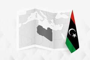 A grayscale map of Libya with a hanging Libyan flag on one side. Map for many types of news. vector