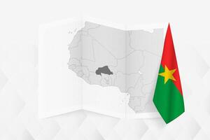 A grayscale map of Burkina Faso with a hanging Burkinabe flag on one side. Map for many types of news. vector