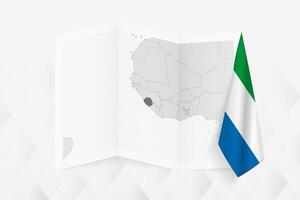 A grayscale map of Sierra Leone with a hanging Sierra Leonean flag on one side. Map for many types of news. vector