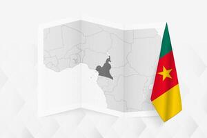 A grayscale map of Cameroon with a hanging Cameroonian flag on one side. Map for many types of news. vector