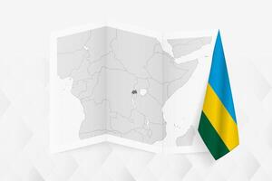 A grayscale map of Rwanda with a hanging Rwandan flag on one side. Map for many types of news. vector