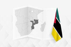 A grayscale map of Mozambique with a hanging Mozambican flag on one side. Map for many types of news. vector