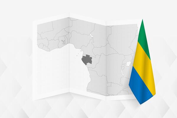 A grayscale map of Gabon with a hanging Gabonese flag on one side. Map for many types of news.