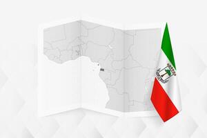 A grayscale map of Equatorial Guinea with a hanging Equatorial Guinean flag on one side. Map for many types of news. vector