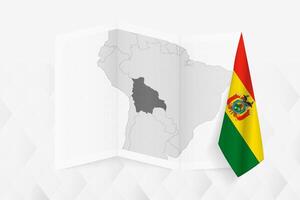 A grayscale map of Bolivia with a hanging Bolivian flag on one side. Map for many types of news. vector